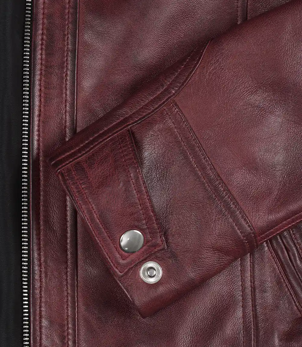 Women's Burgundy Biker Jacket – Collar and Cuff Detail Close-up of snap button collar and cuffs on burgundy leather jacket