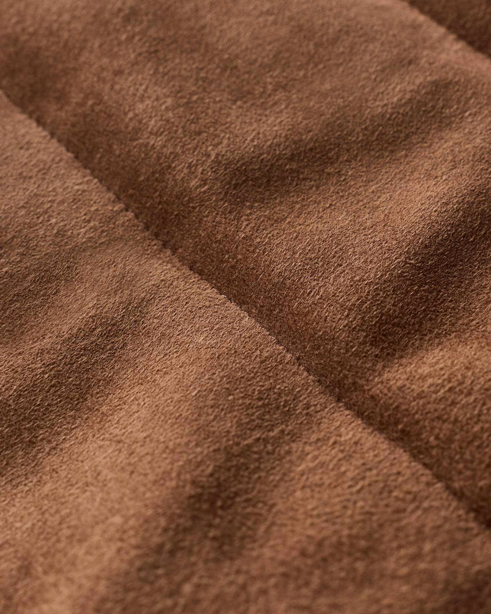 Suede Puffer Vest – Detail Shot Close-up of suede puffer vest